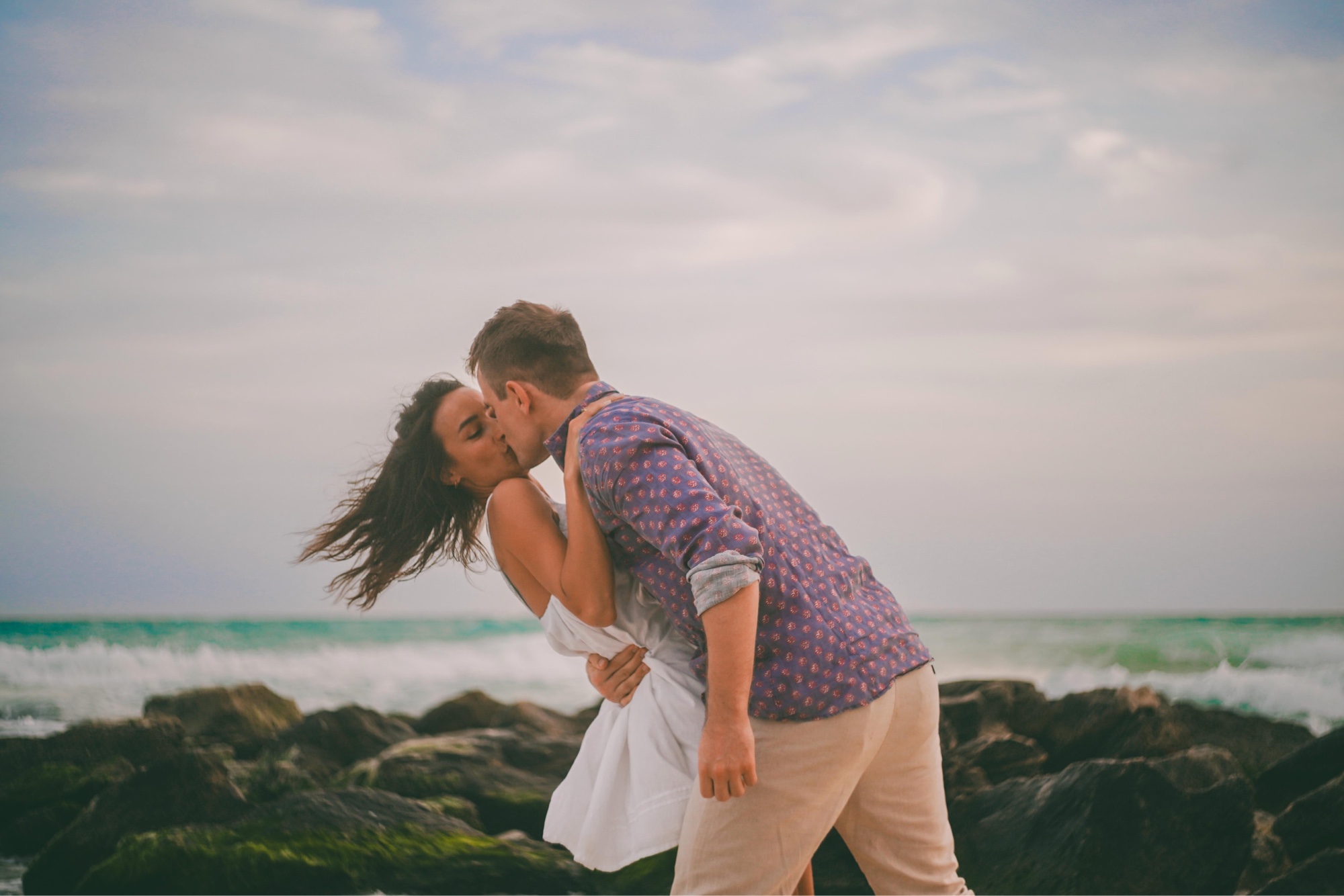 Couple on the beach rocks, Riviera Maya
