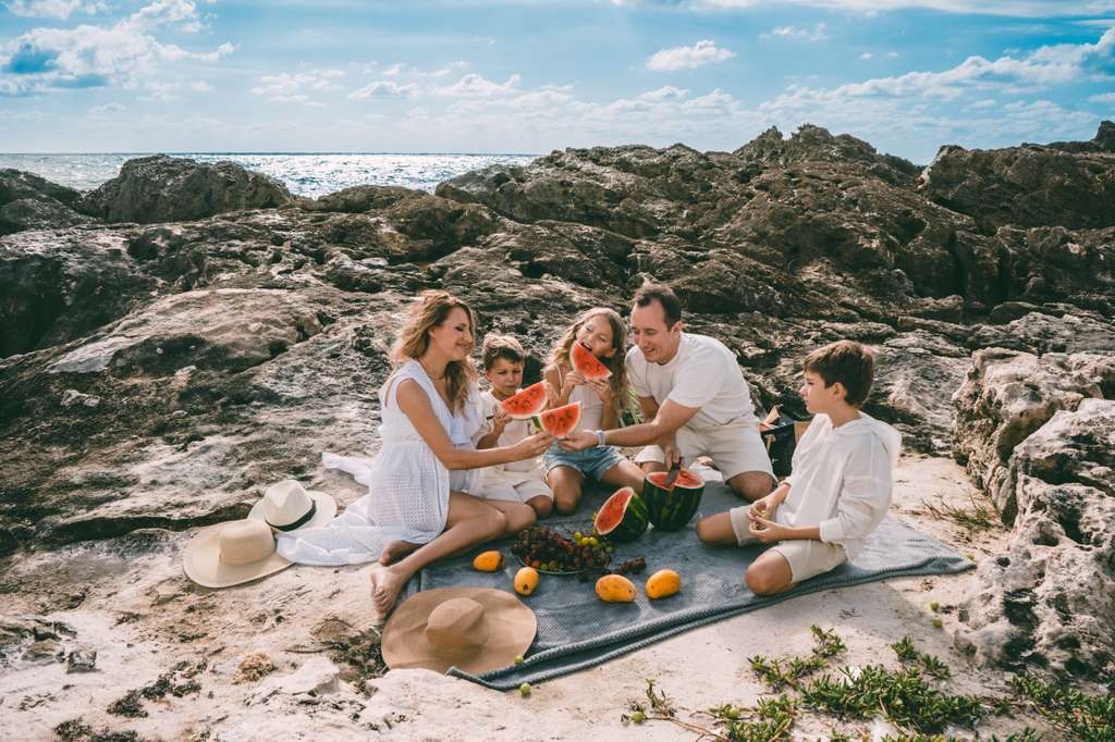 Family picnic on the rocks, Playa del Carmen