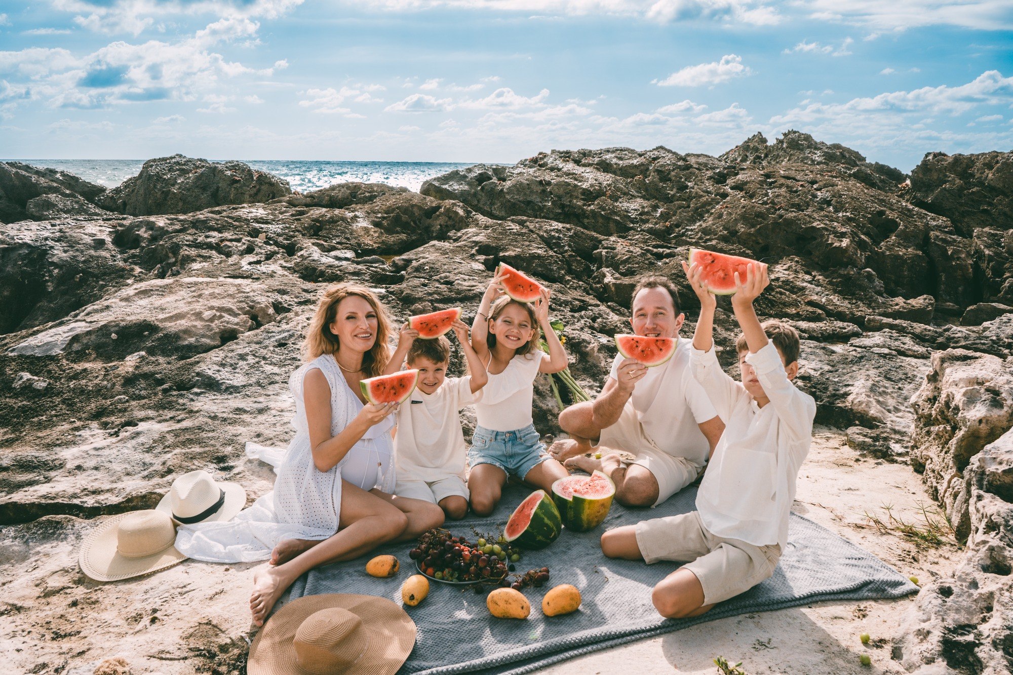 Family of five on the beach at sunset, Riviera Maya